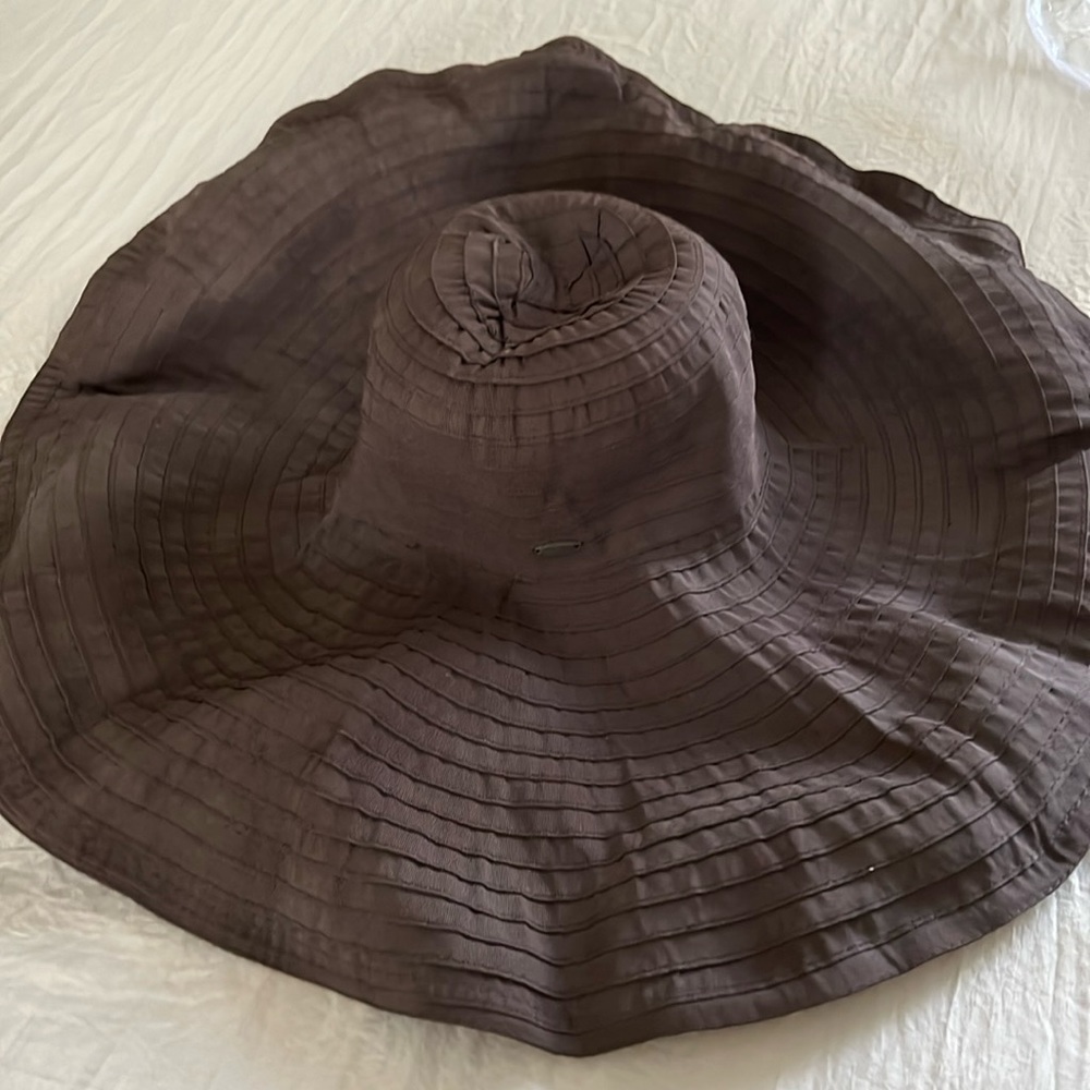 Fabric hat with wire edging to drape as desired.